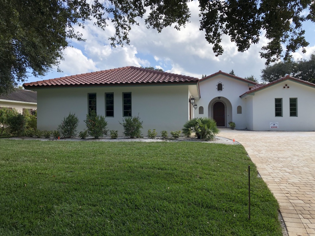 Elegant Spanish-style home with lush irrigated lawn